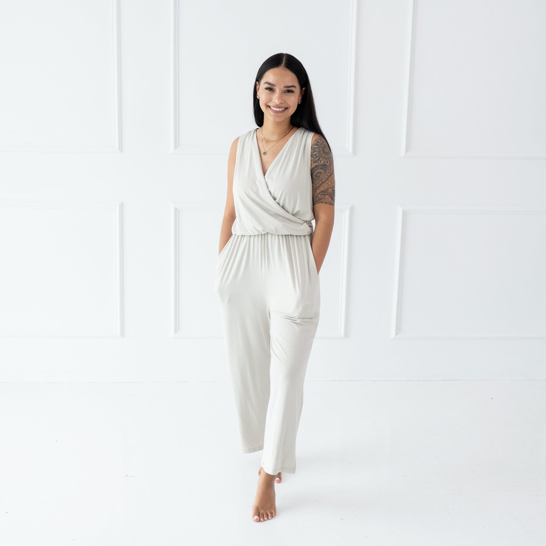 Woman wearing Kyte Baby Women's Jumpsuit with pockets in Oat