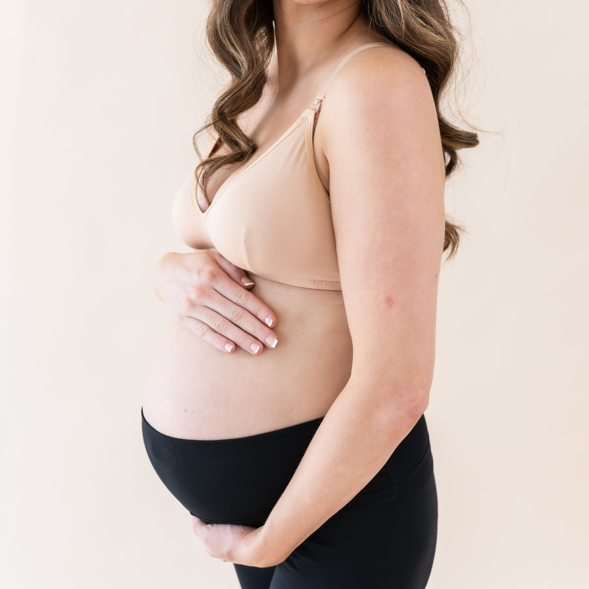 Woman wearing Kyte Baby Women's Nursing Bra with adjustable straps in Chai