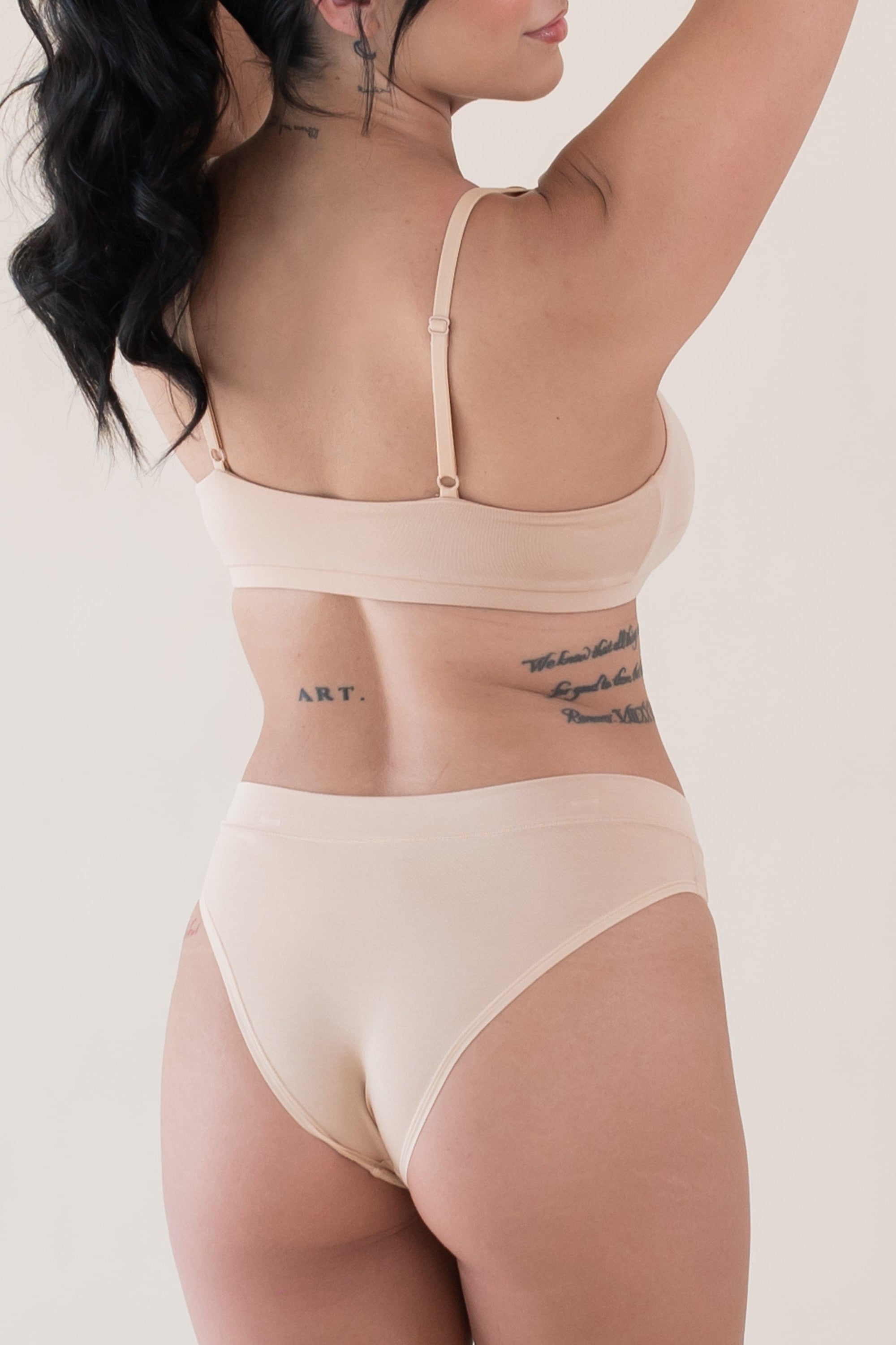 Woman wearing Kyte Baby Women's Scoop Neck Bralette and Underwear in Chai