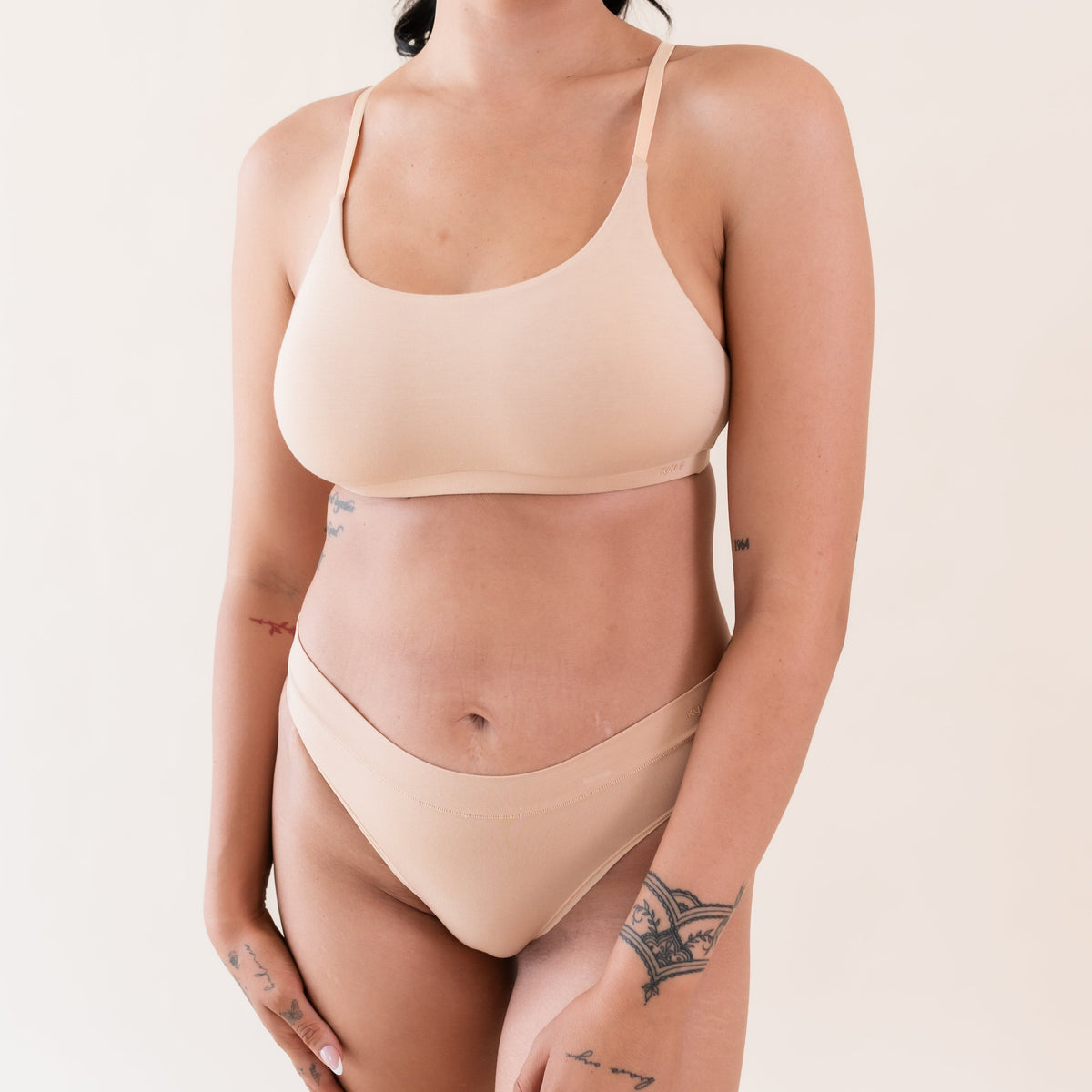 Woman wearing Kyte Baby Women's Scoop Neck Wireless Bra in Chai