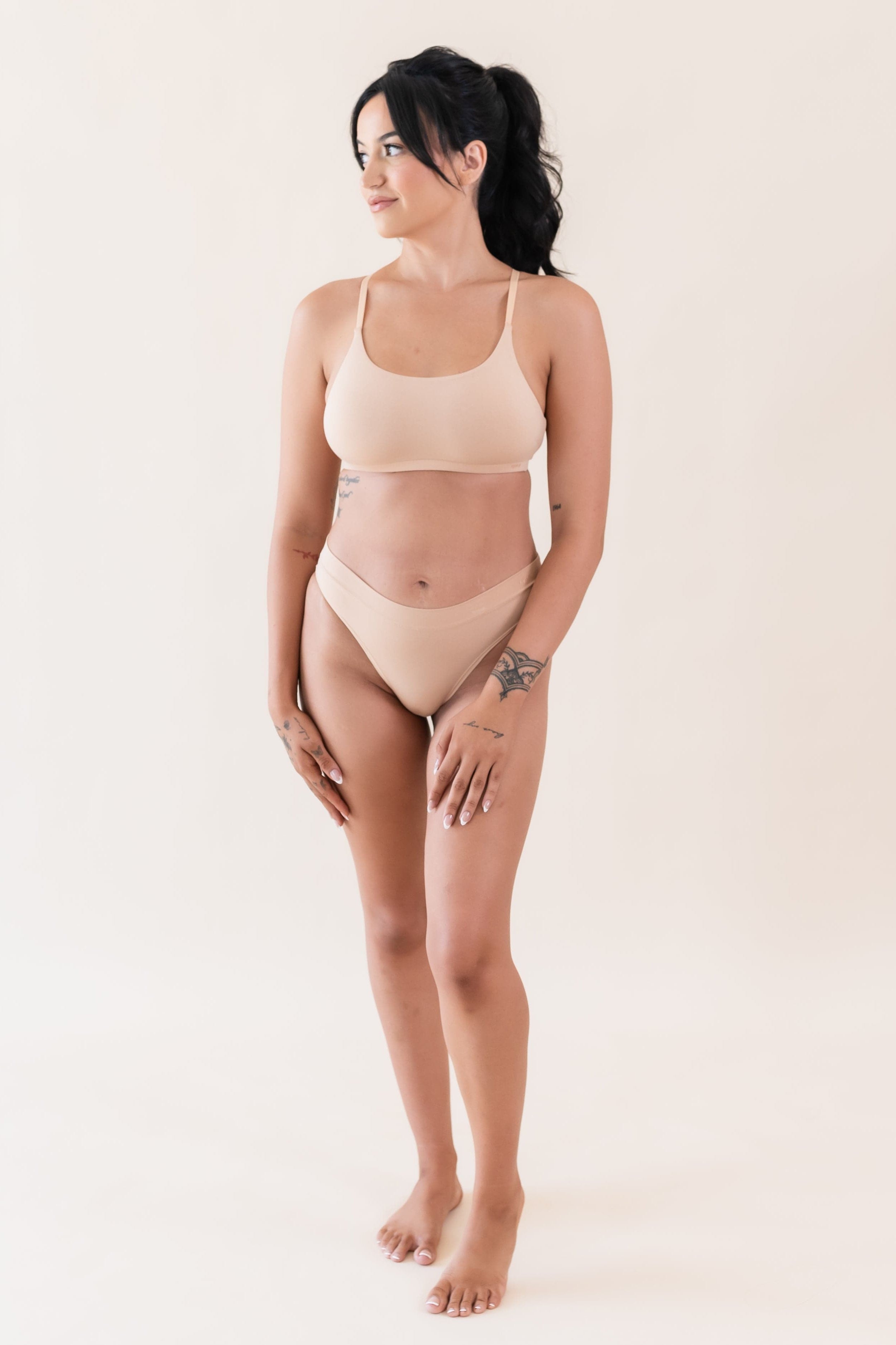 Woman wearing Kyte Baby Women's Scoop Neck Bralette in Chai