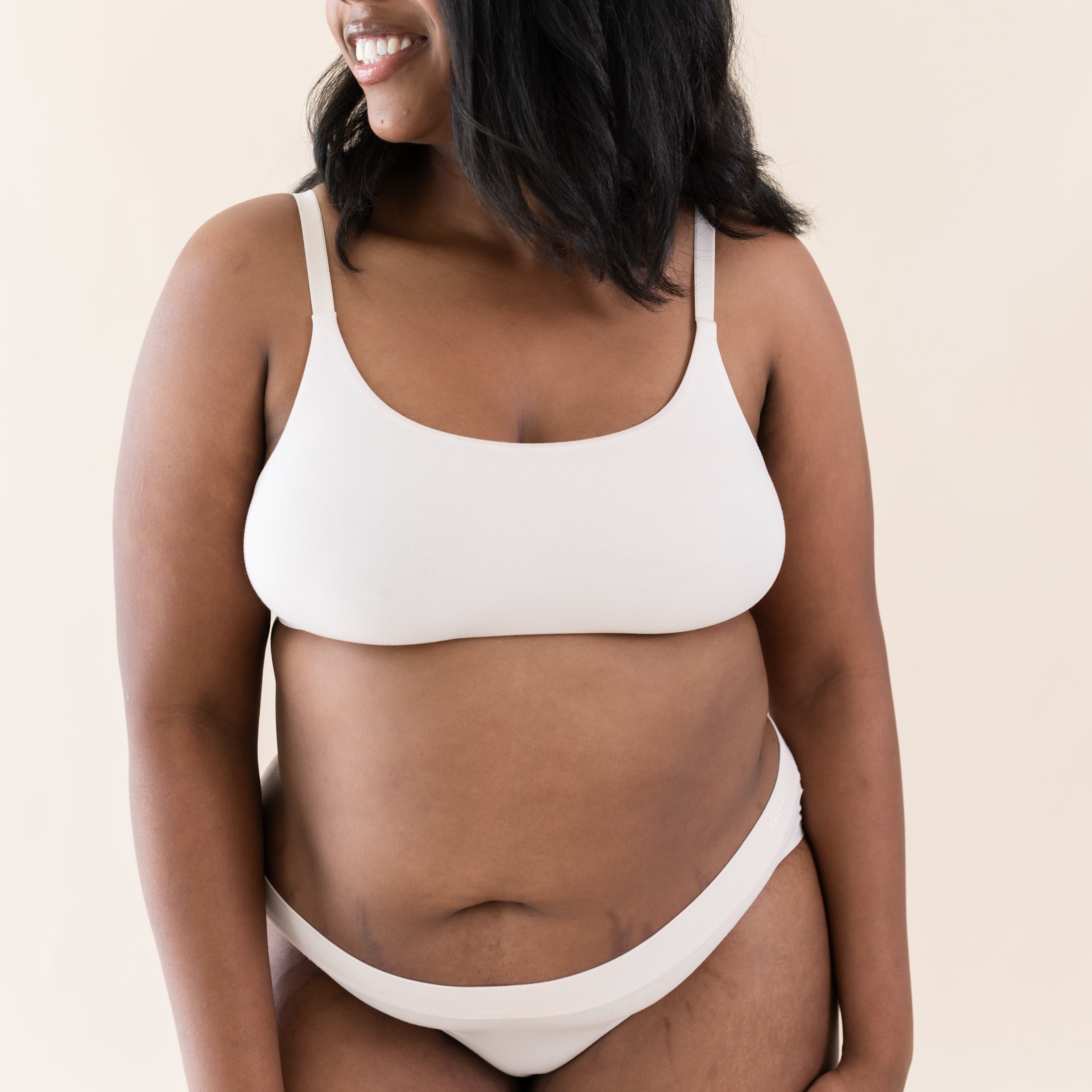 Woman wearing Kyte Baby Women's Scoop Neck Bralette in Blonde