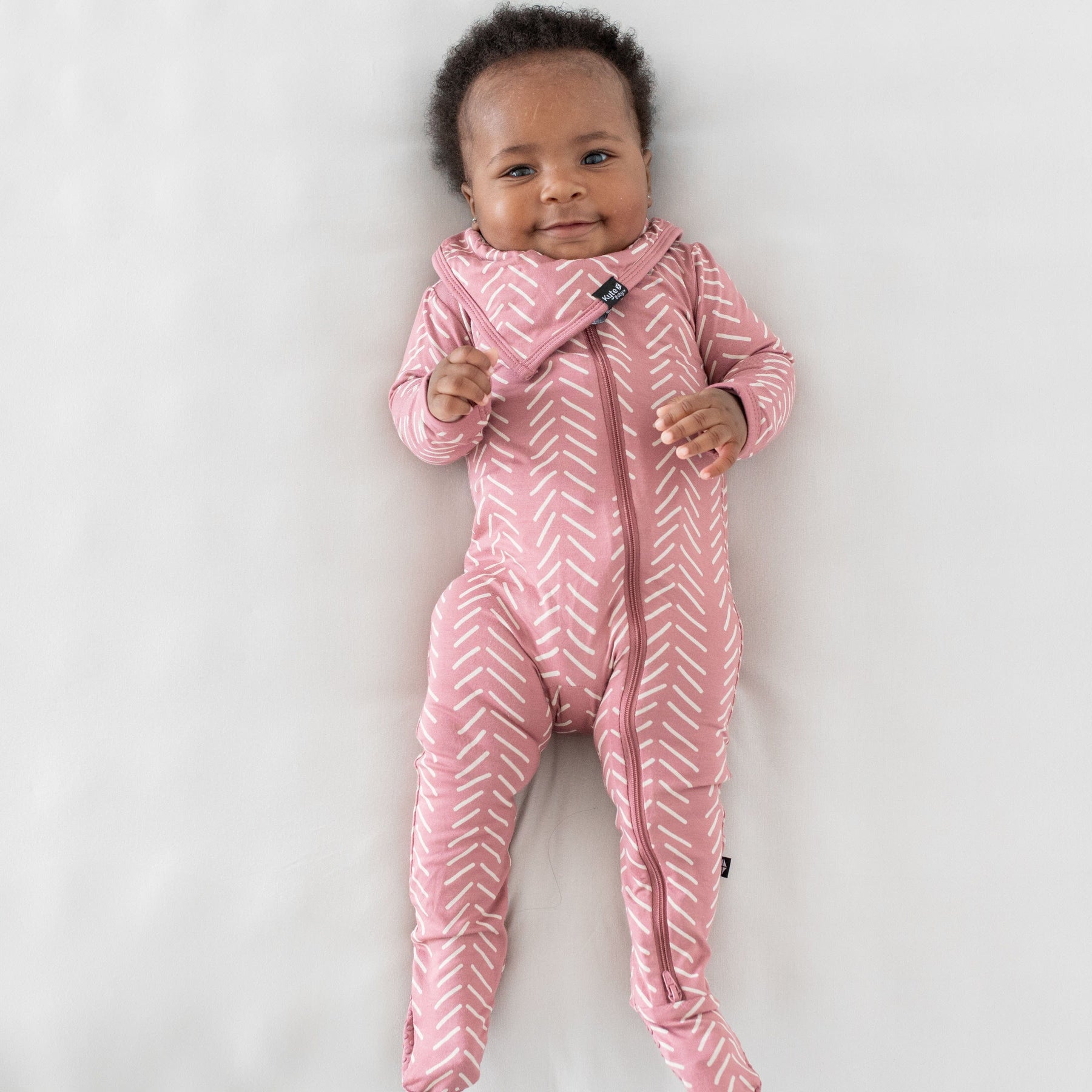 Kyte Baby Zippered Footies Zippered Footie in Dusty Rose Herringbone