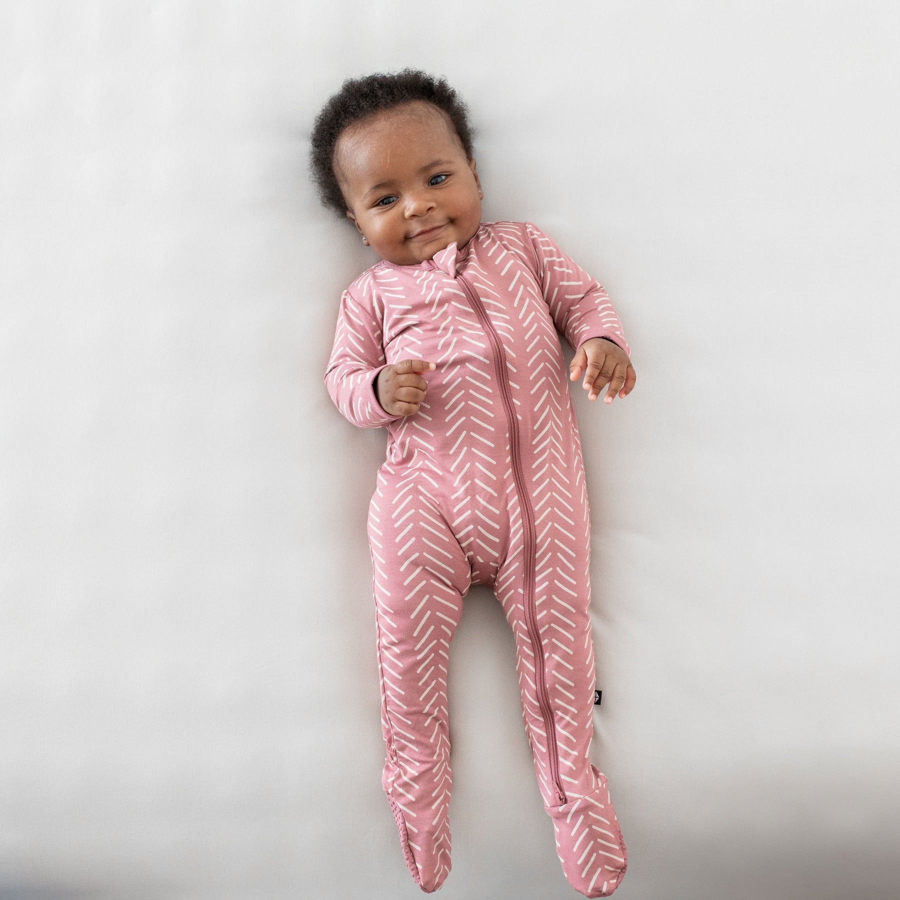 Kyte Baby Zippered Footies Zippered Footie in Dusty Rose Herringbone