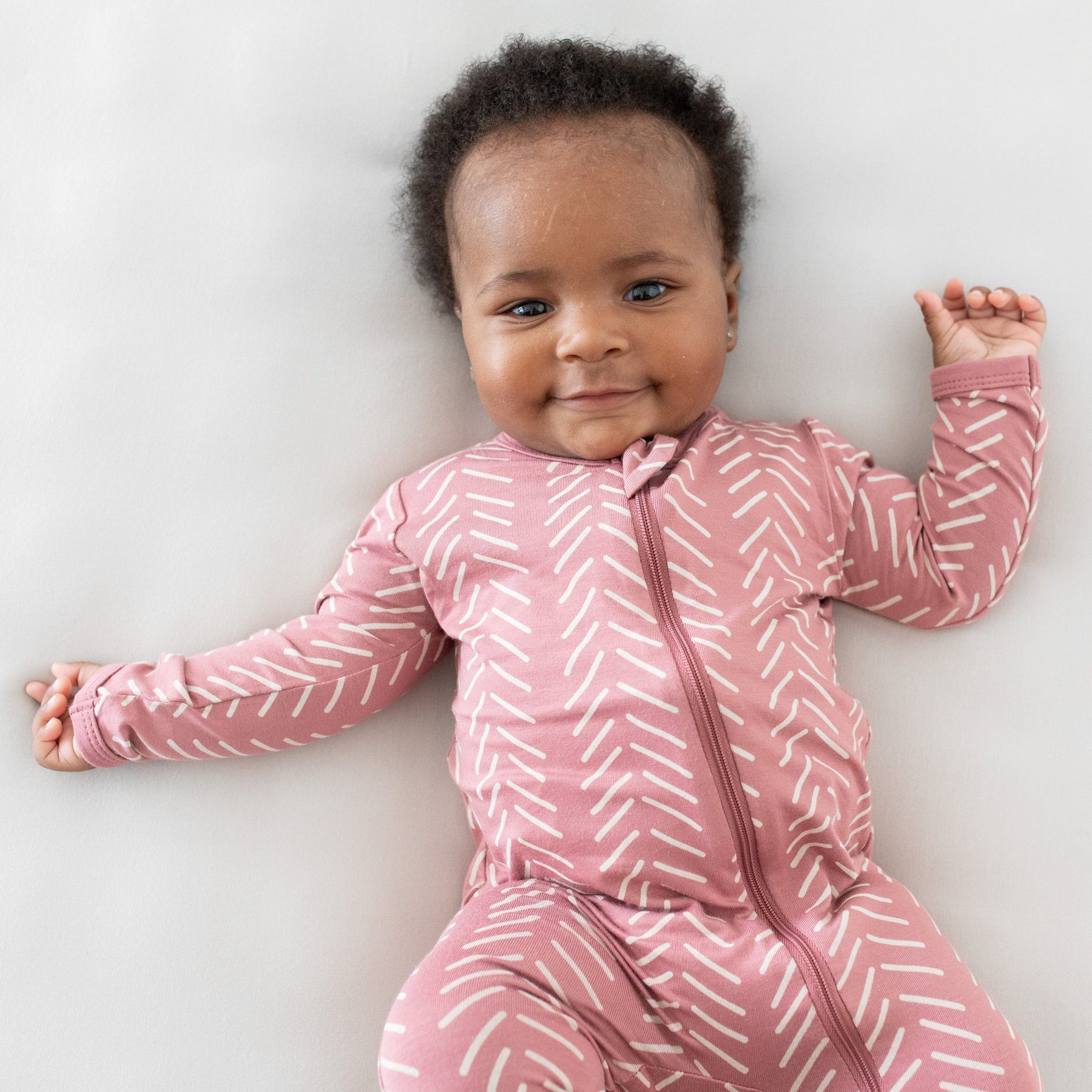 Kyte Baby Zippered Footies Zippered Footie in Dusty Rose Herringbone