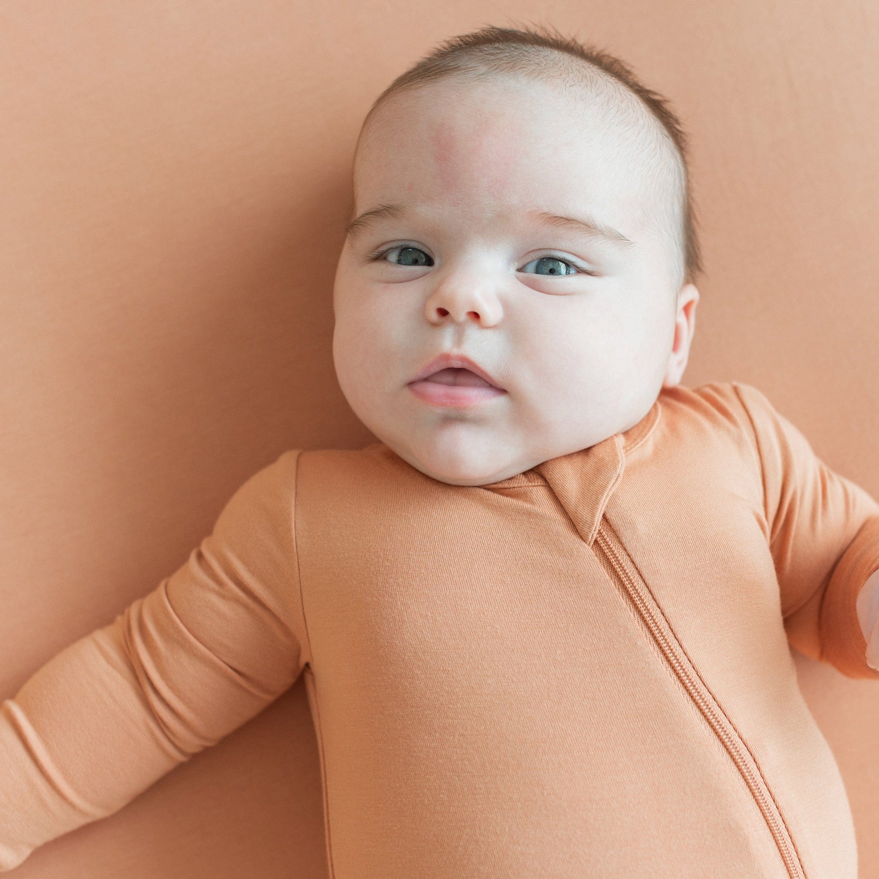Kyte Baby Zippered Rompers Zippered Romper in Apricot