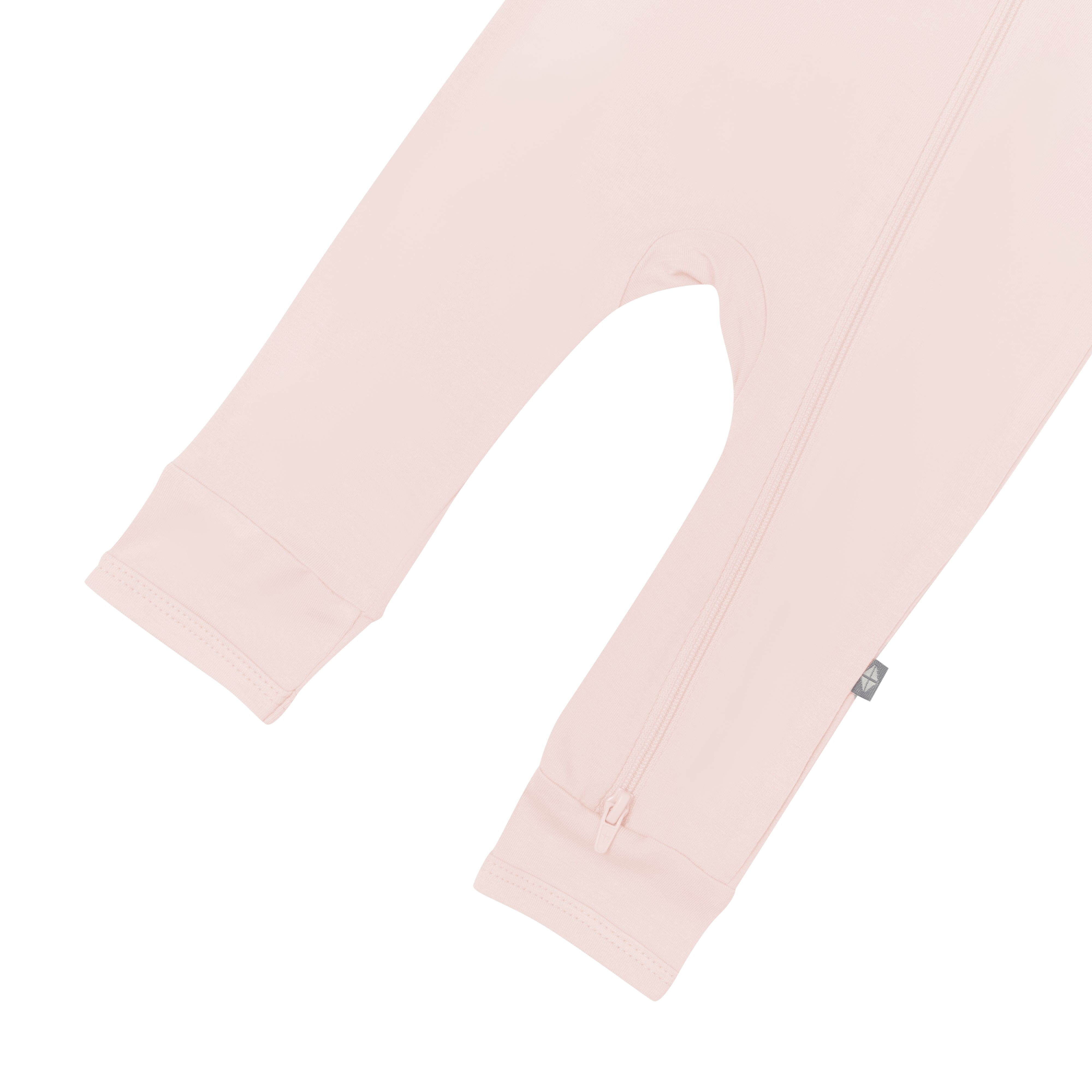 Open feet on Kyte Baby Zippered Romper in Blush