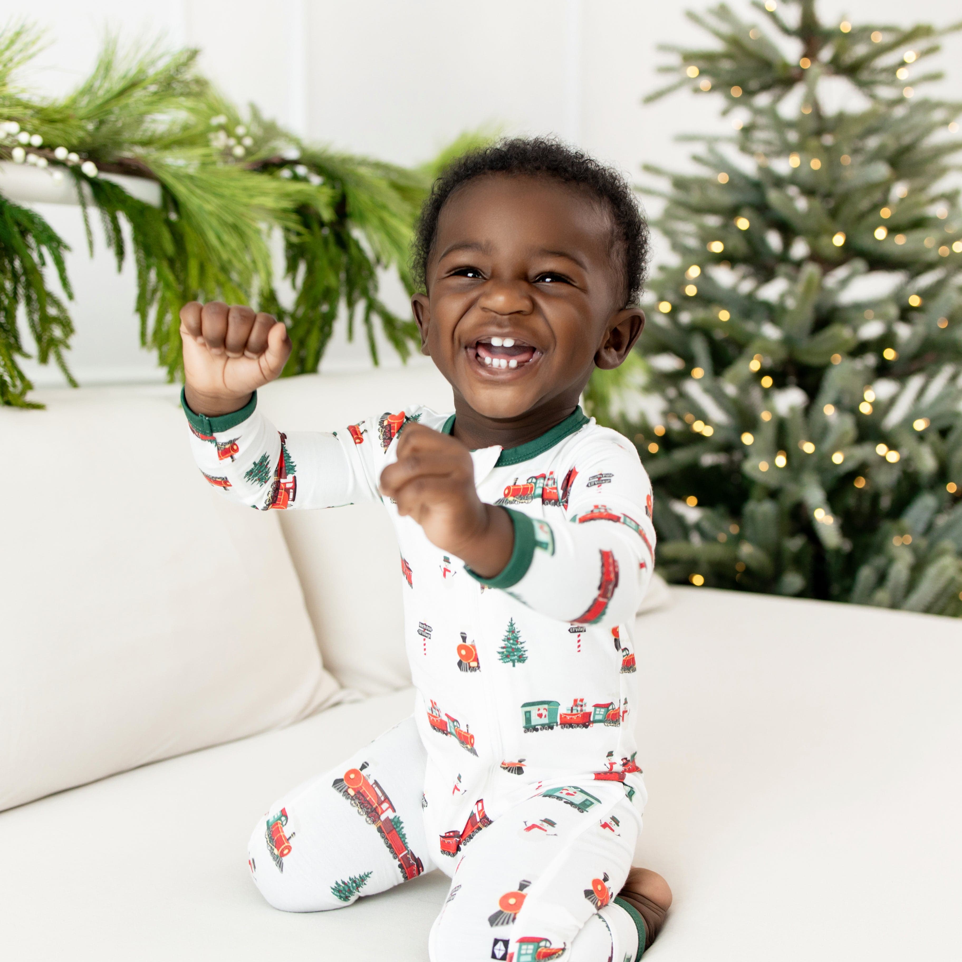 Kyte Baby Zippered Rompers Zippered Romper in Holiday Train