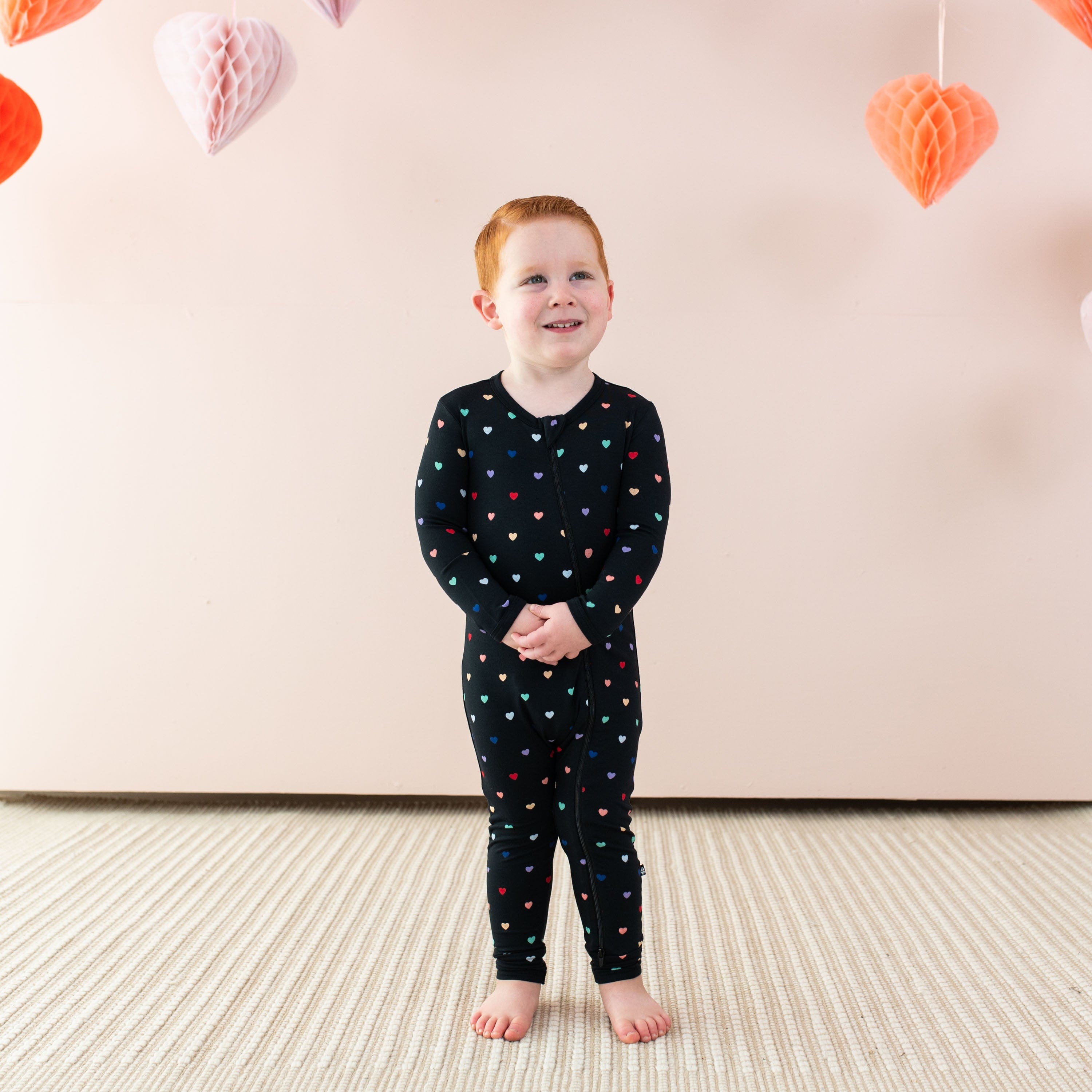 Kyte Baby Zippered Rompers Zippered Romper in Midnight Rainbow Heart
