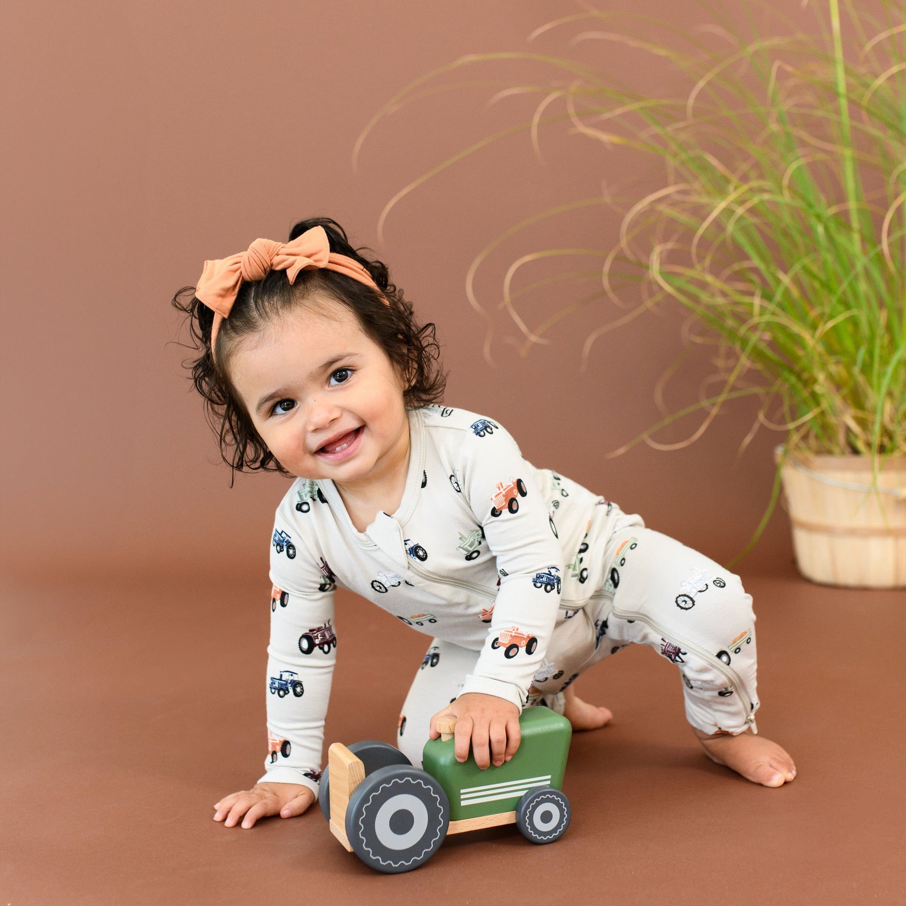 Kyte Baby Zippered Rompers Zippered Romper in Tractor