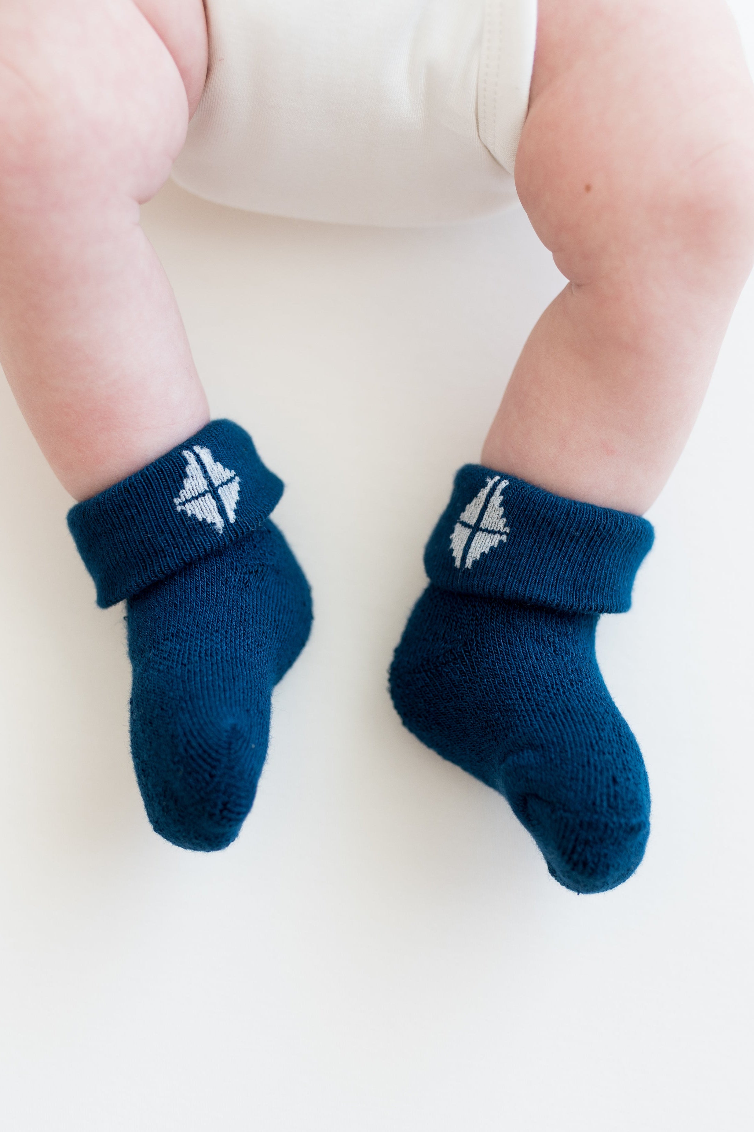 Infant wearing Tahoe blue infant socks