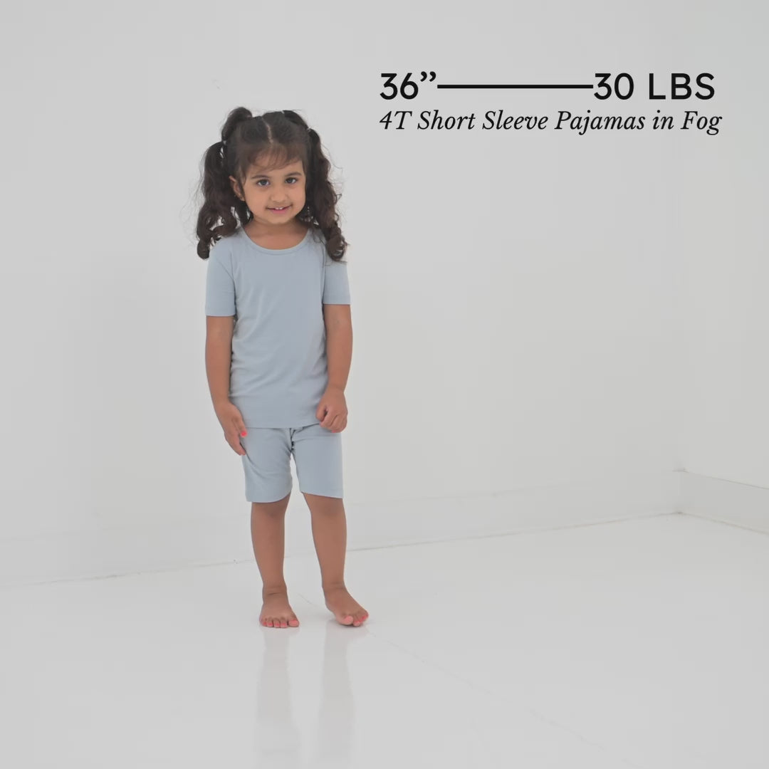 Video of Child wearing Short Sleeve Blue Pajama sets in Fog