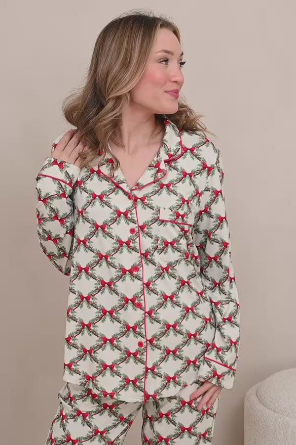 Female modeling the Long-Sleeved Women's Pajama Set in Holiday Bow