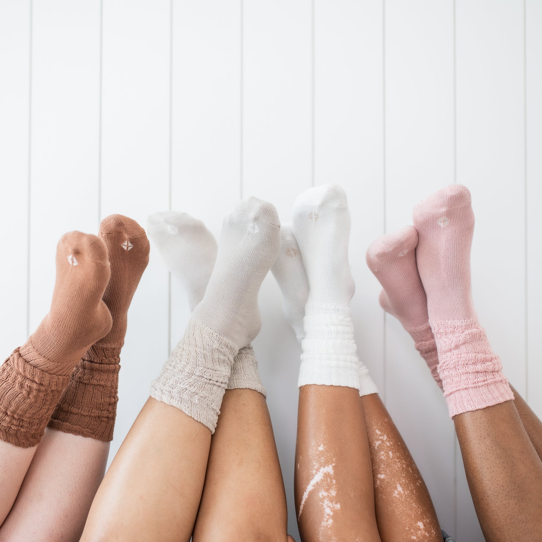 Adult Scrunch Socks in Latte, Oat, Cloud and Blush shown on models