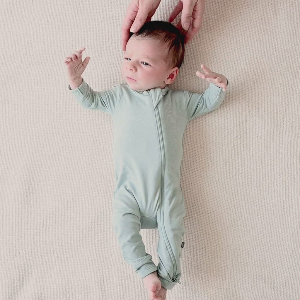 Video of toddler wearing Kyte Baby Zippered Romper in Sage