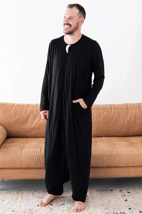 Man wearing Kyte Baby Adult Sleep Bag Walker in Midnight