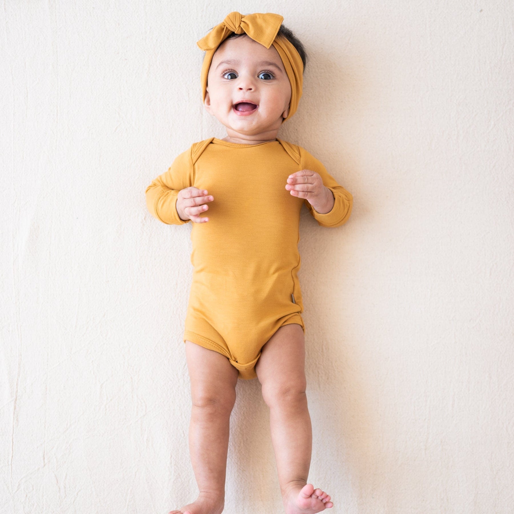 Kyte BABY Long Sleeve Bodysuits Long Sleeve Bodysuit in Marigold