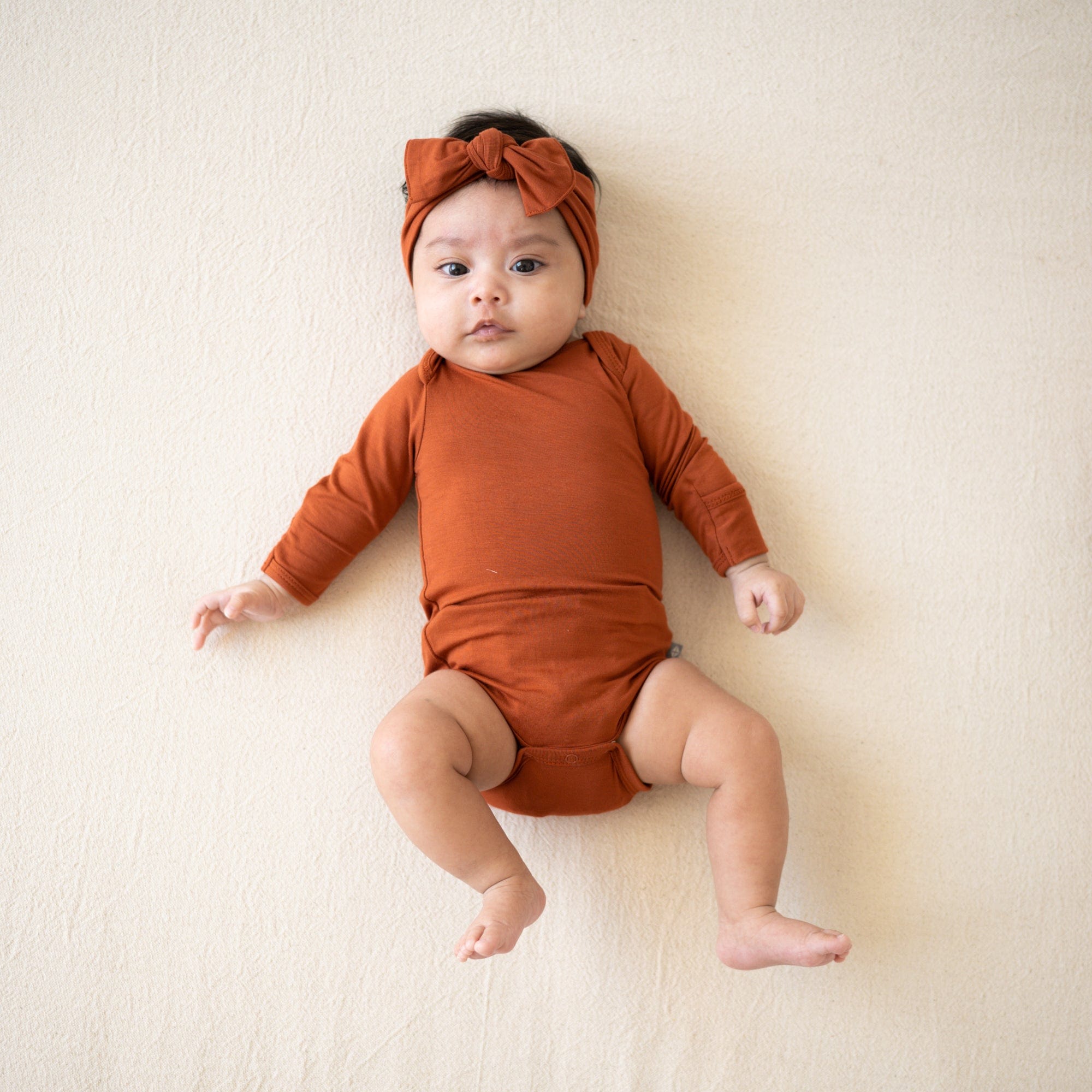 Kyte BABY Long Sleeve Bodysuits Long Sleeve Bodysuit in Rust