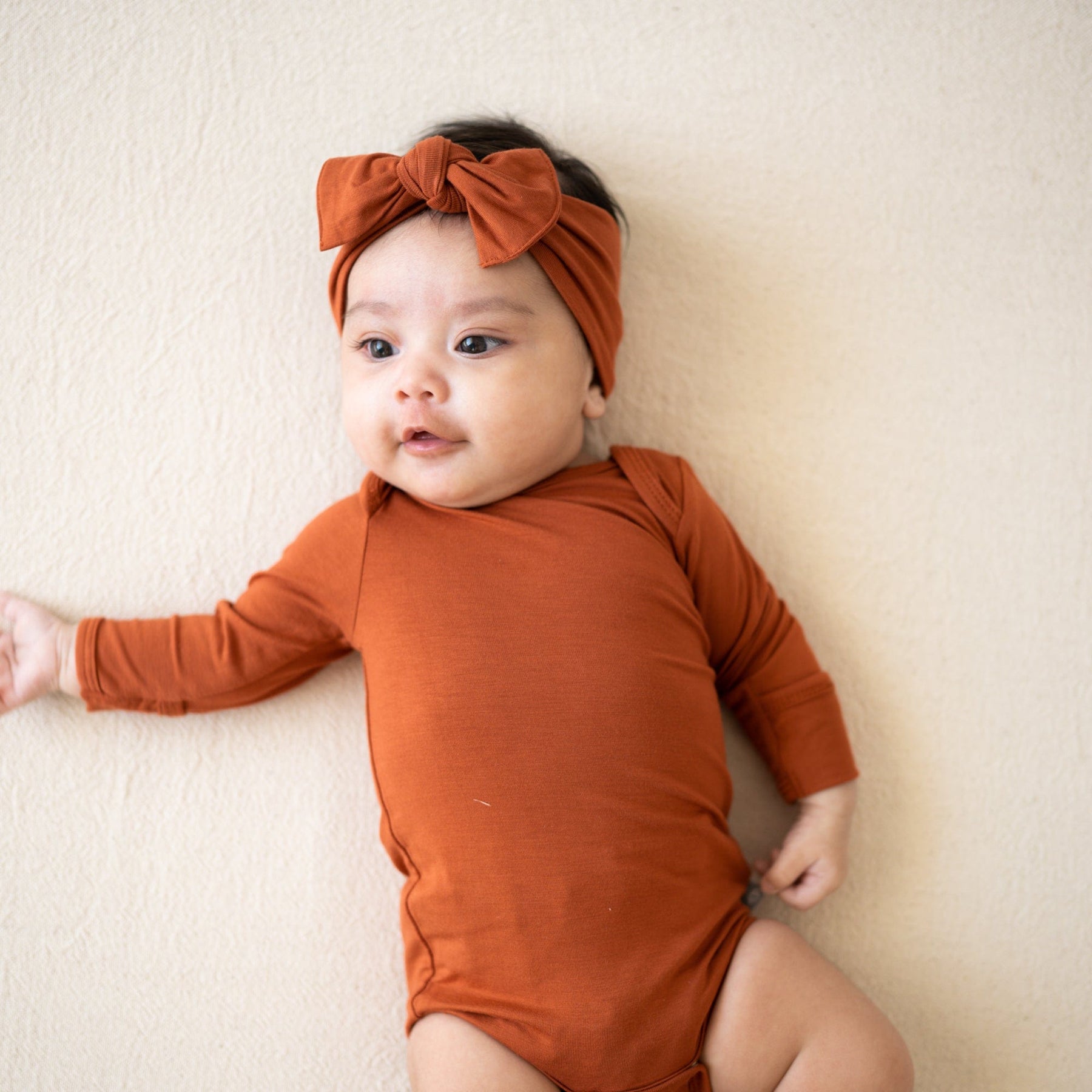 Kyte BABY Long Sleeve Bodysuits Long Sleeve Bodysuit in Rust