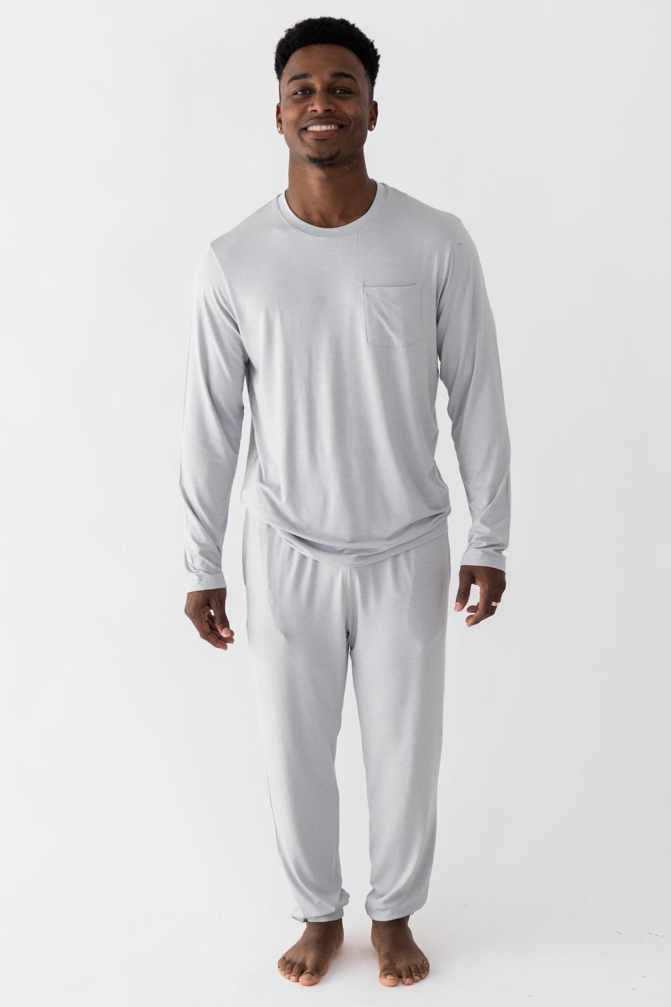 Man wearing Kyte Baby men's jogger set in Storm gray