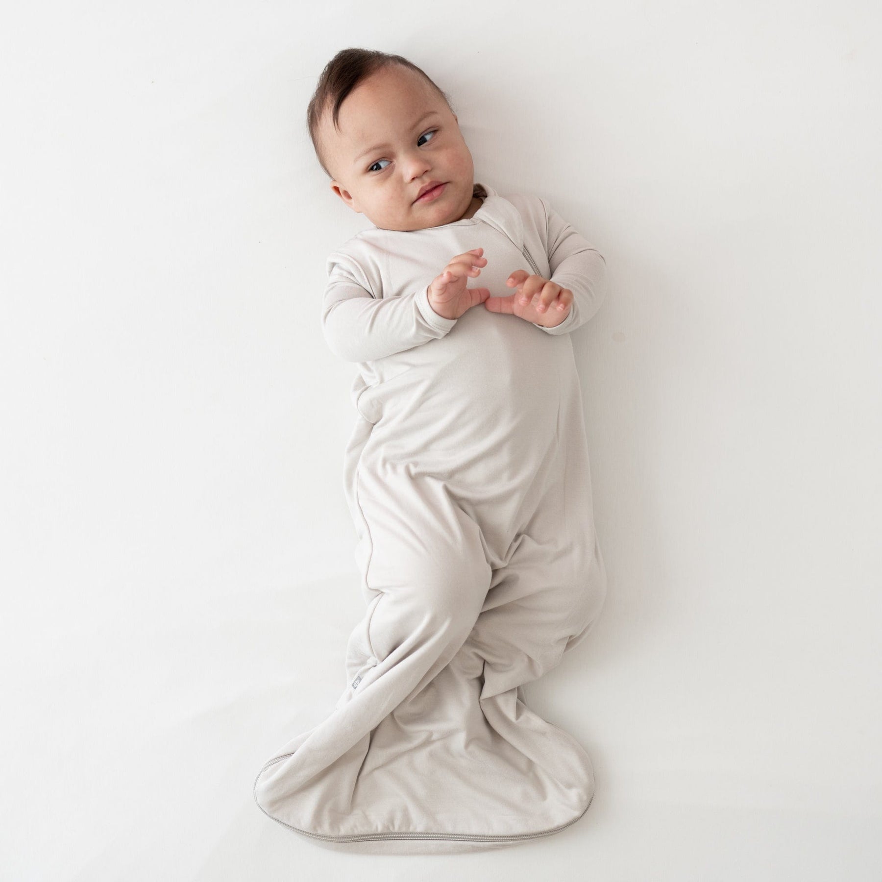 Baby wearing Kyte Baby bamboo Sleep Bag 0.5 in Oat
