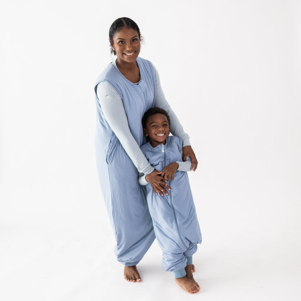 Mom and son in matching Kyte Baby Sleep Bag Walkers in Slate 1.0