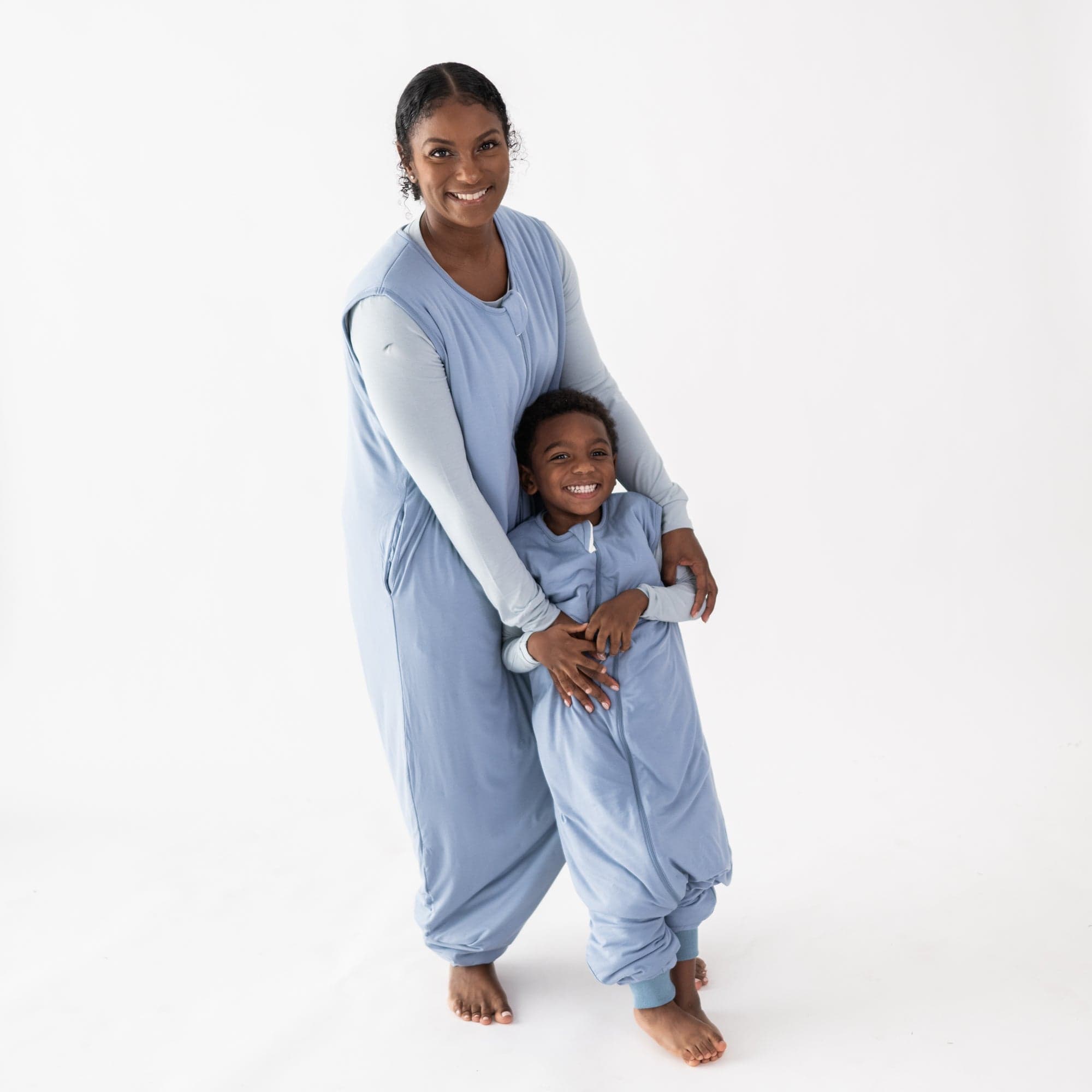 Mom and son in matching Kyte Baby Sleep Bag Walkers in Slate 2.5
