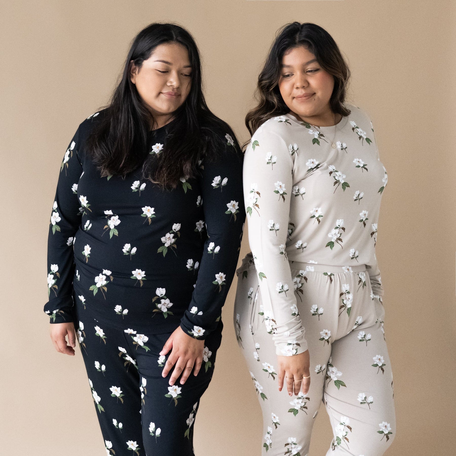 Women wearing Kyte Baby women's jogger pajama sets in Magnolia pattern