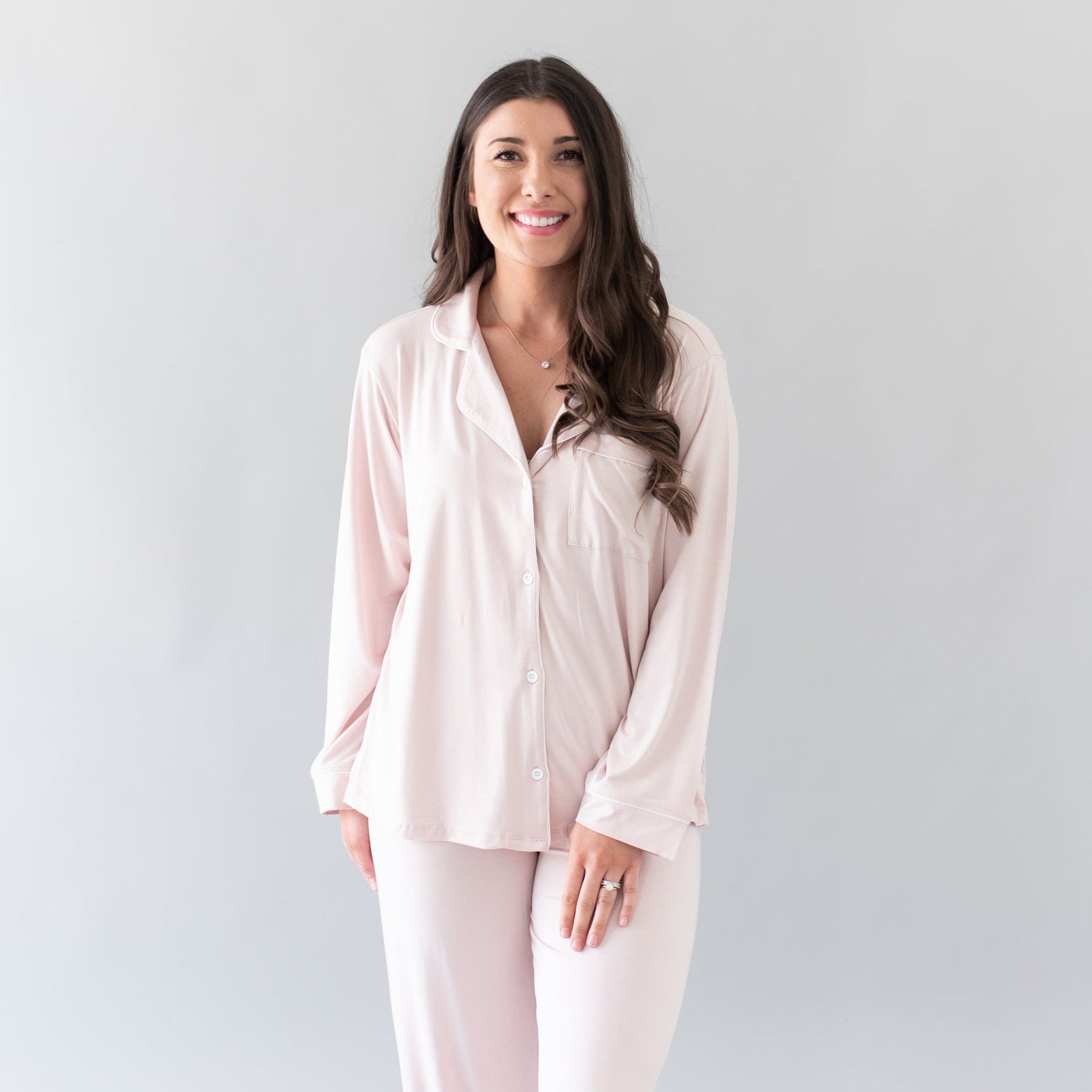 Woman wearing Women's breathable bamboo Long Sleeve Pajama Set in Blush with Cloud Trim