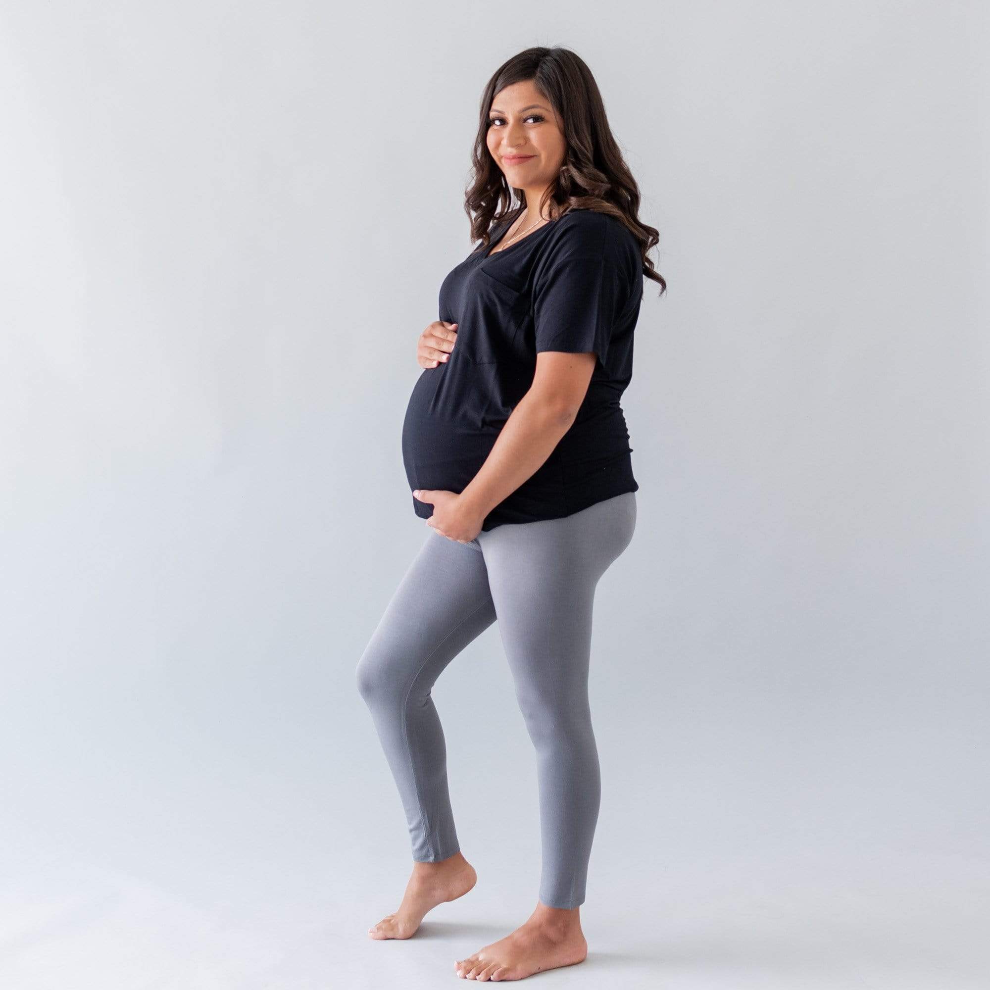 Woman wearing Kyte Baby Women's Relaxed Fit V-Neck in Midnight